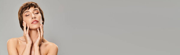 Young woman with hands on face.