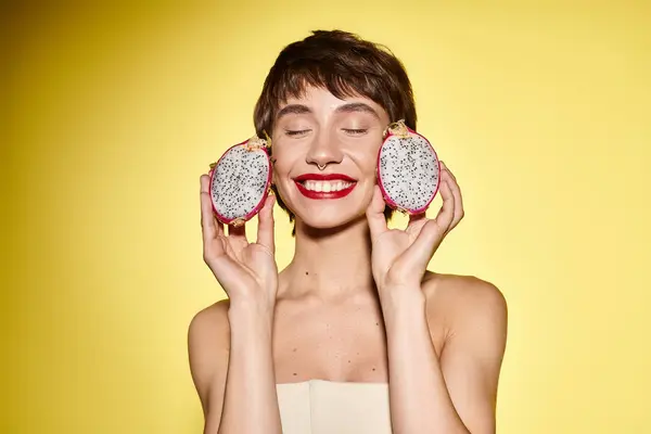 Young Woman Playfully Holds Two Donuts Front Her Face — Stock Photo, Image