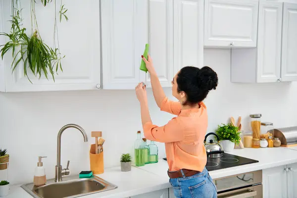 Stylish Woman Casual Attire Methodically Scrubs Kitchen Sink Vibrant Green — Stock Photo, Image