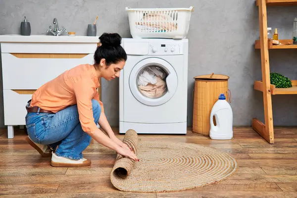 Stylish Woman Casual Attire Kneeling Colorful Rug While Cleaning Her — Stock Photo, Image