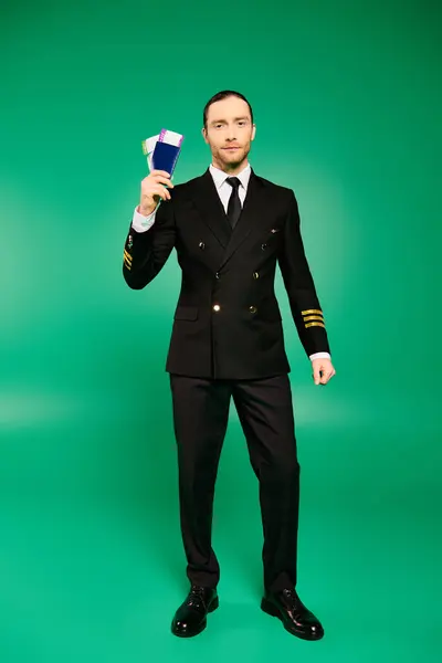 Handsome Pilot Black Suit Holding Passport —  Fotos de Stock