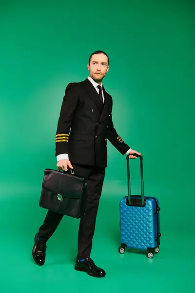 stock image A man in a suit and tie holds a suitcase.