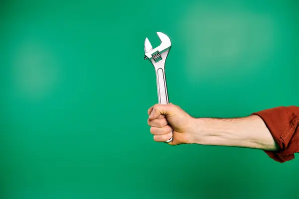 Handsome Male Worker Uniform Holding Wrench Green Backdrop — Stock Photo, Image