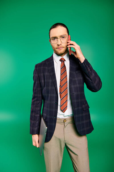 A handsome businessman in a chic suit talking on a cell phone.