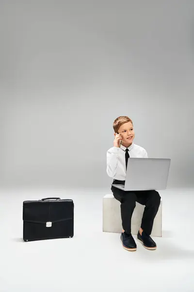Young Boy Elegant Attire Sits Stool Engrossed Laptop — Stock Photo, Image