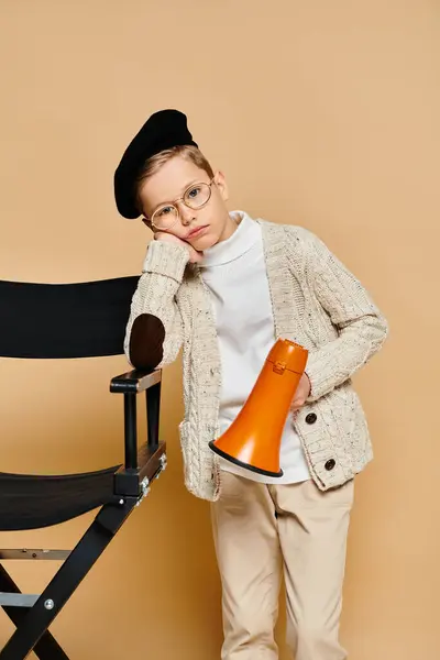 stock image Preadolescent boy dressed as a film director holds a megaphone.