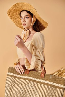 A young woman with long brunette hair strikes a pose in a summer outfit while holding a brown and white bag. clipart