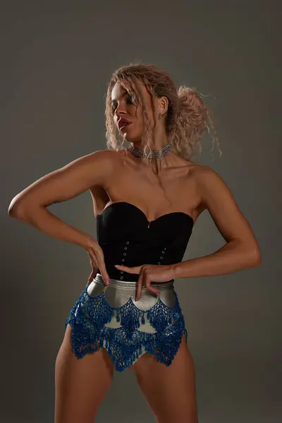 Young Woman Stylish Black Top Blue Shorts Poses Captivating Alluring —  Fotos de Stock