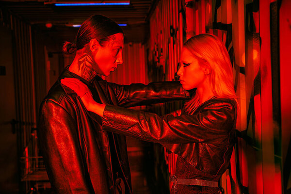 A man and a woman standing in a room together