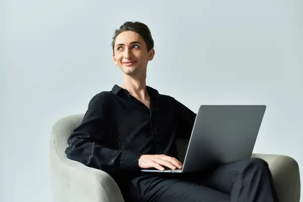 Young Queer Person Grey Background Sits Chair Laptop Exuding Confidence — Foto de Stock