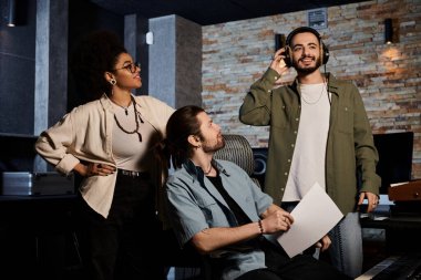 A music band in a recording studio engaged in deep conversations during rehearsal. clipart