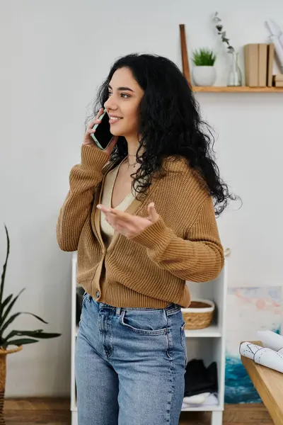 stock image Stylish woman transforms clothing while chatting on phone.