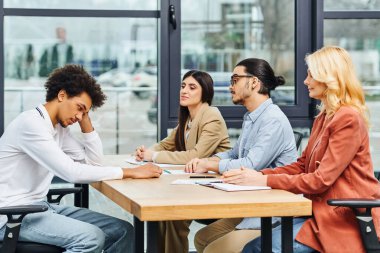 Job seekers in interview at office table clipart