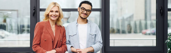 Good looking woman engages in conversation with a man during job interview.