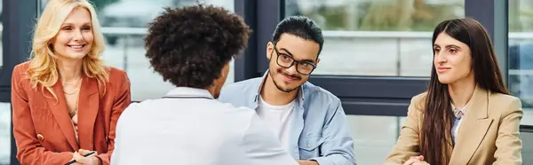 stock image Job seekers engage in a collaborative meeting in a conference room.