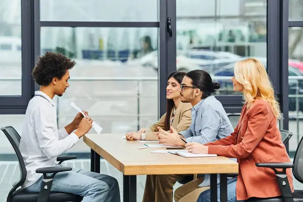 stock image Intense job interview with potential employees in a bustling office setting.