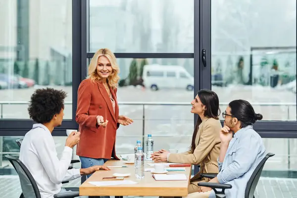 stock image Professionals discussing in a conference room.