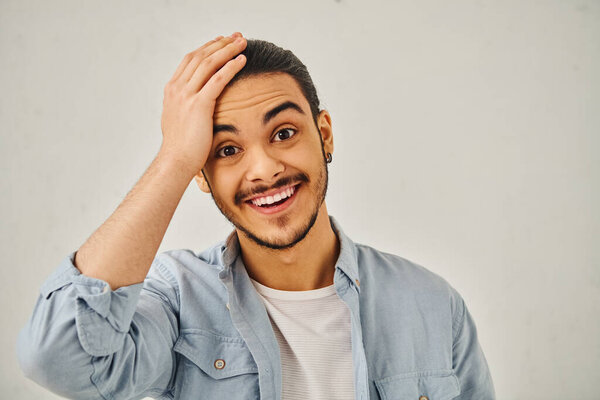 Young man smiling at camera.