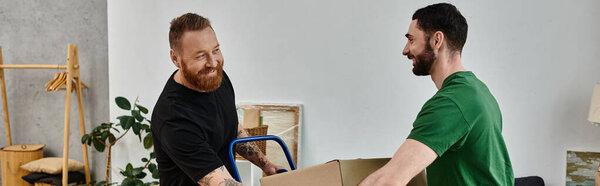 A gay couple, in love, embracing each other in a room surrounded by moving boxes, starting a new chapter in their lives.