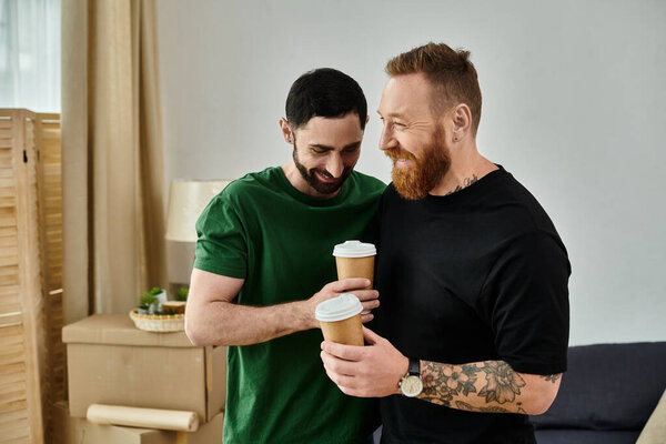 A couple of men sharing a heartfelt moment, standing side by side amidst boxes in their new home, symbolizing a fresh start.