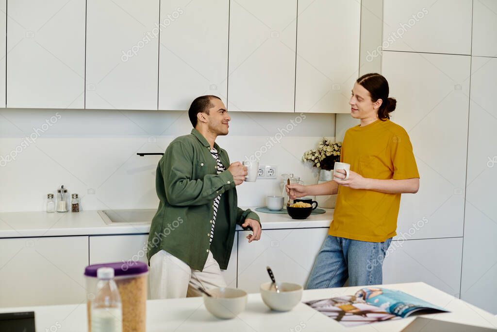 A young gay couple enjoys a casual morning in their modern apartment, sharing coffee and conversation.