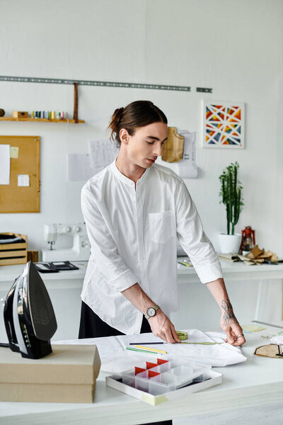 A young designer meticulously measures fabric in his DIY clothing restoration atelier, transforming discarded clothing into unique pieces.