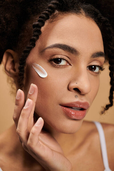 A close-up portrait of a young African American woman with beautiful skin.