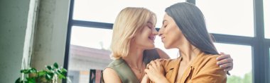 lesbian couple in smart casual attire stand close together in a modern office, suggesting a romantic relationship clipart