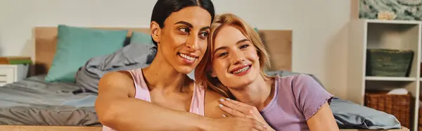 stock image A happy lesbian couple embraces in their cozy home, radiating warmth and love.