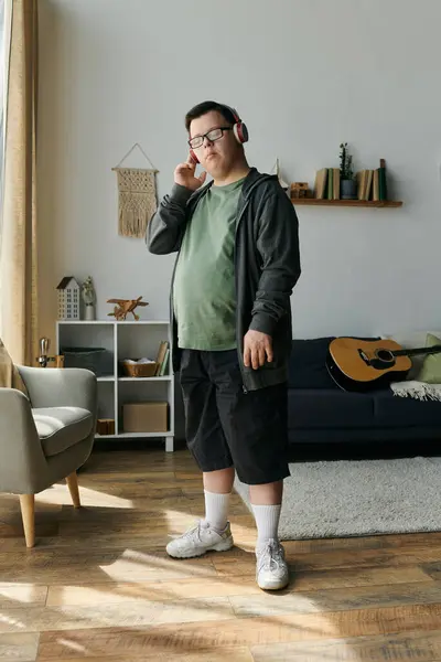 Stock image A man with Down syndrome listens to music, surrounded by a warm, inviting atmosphere.