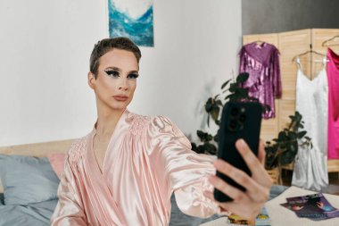 A confident drag queen poses while taking a selfie in a chic setting. clipart