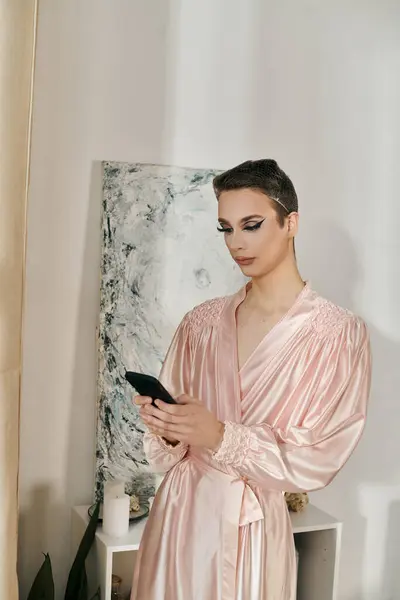 stock image An attractive drag queen poses confidently while checking their phone.