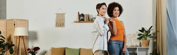 stock image A heartfelt goodbye unfolds as a soldier bids farewell to her loving wife in their cozy living room.