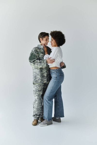 A young couple shares a tender moment as one prepares for military service.