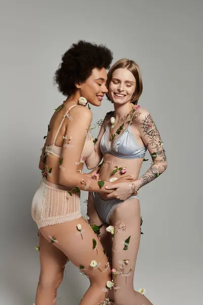 stock image Loving couple enjoys a tender moment surrounded by delicate flowers.