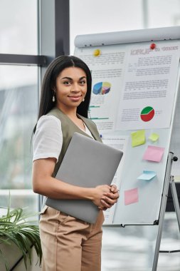 A professional woman engages with her presentation materials. clipart