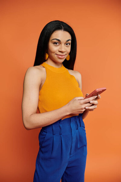 A stylish woman connects with friends while showcasing her vibrant outfit.