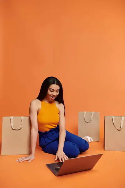 stock image Excitement fills the air as she shops online in vibrant surroundings.