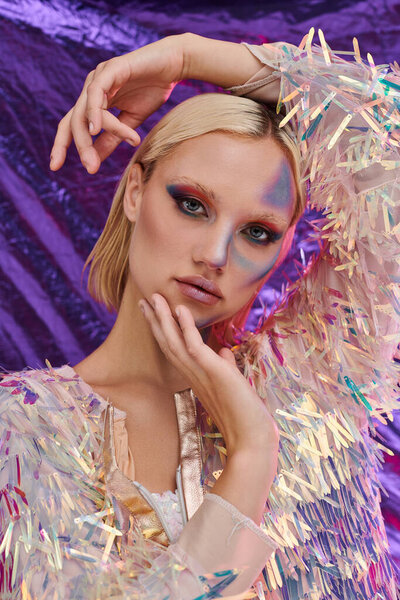 A stylish woman showcases an artistic pose with holographic details.