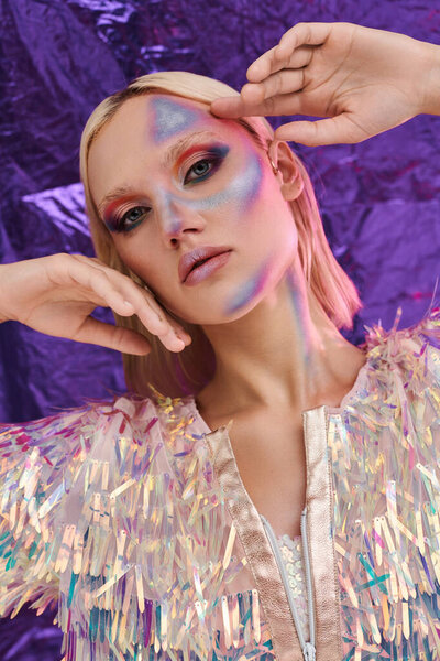 A beautiful young woman showcases stylish attire with holographic accents.