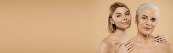 A mature woman and her daughter share a tender moment, exuding love and connection.