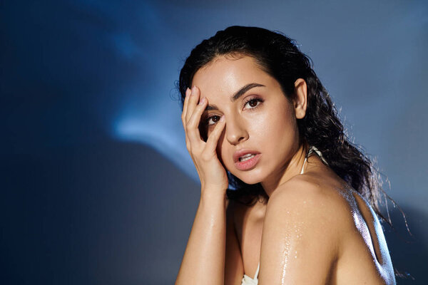 A young woman demonstrates her skincare routine with a vibrant backdrop.
