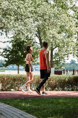 Two friends enjoy a walk outside, showcasing strength and camaraderie in nature beauty. clipart