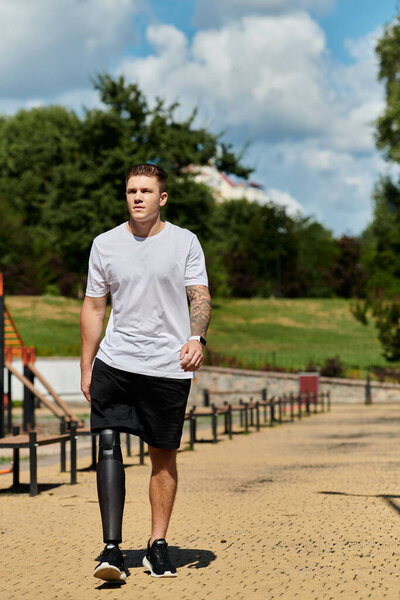 man with artificial foot embracing outdoor workout, exemplifying strength and determination in a vibrant setting.