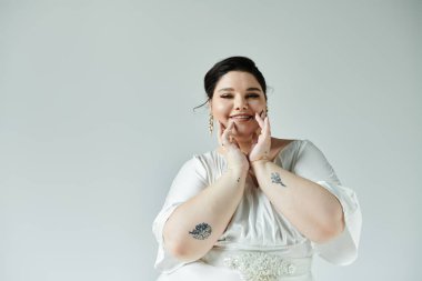 A beautiful plus size bride beams with joy, showcasing her elegant white dress and delicate earrings. clipart