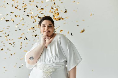 A beautiful bride in a stunning white gown radiates joy amidst a flurry of golden confetti. clipart