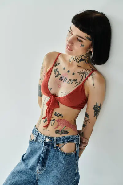 stock image Confidently showcasing fashion and art through body tattoos and modern clothing.