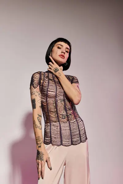 stock image Confident woman showcases her unique style and body art in fashionable attire.