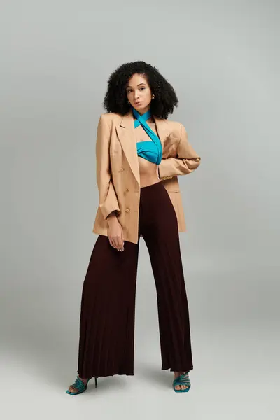 stock image Elegant model displays modern fashion trends with unique outfit choices and bold colors.