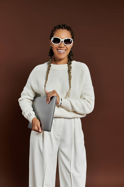 Young woman in elegant warm attire posing actively.